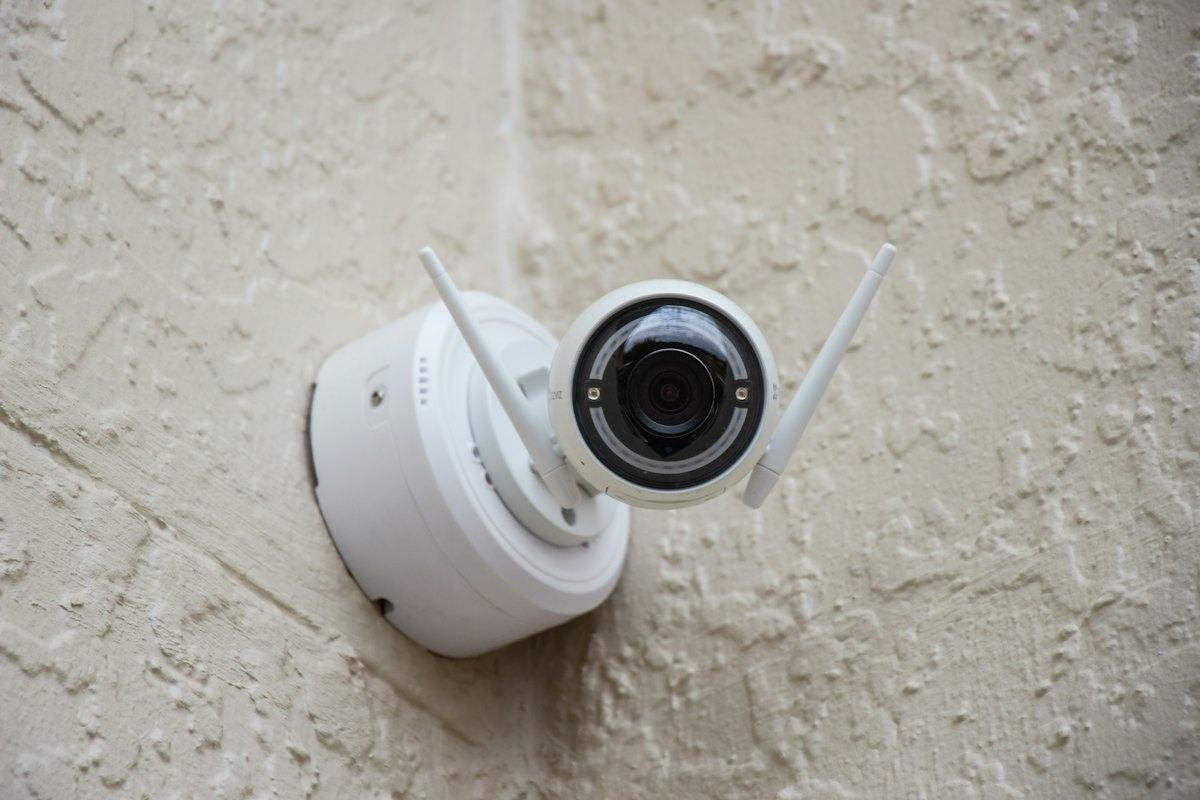 White wireless camera on a wall