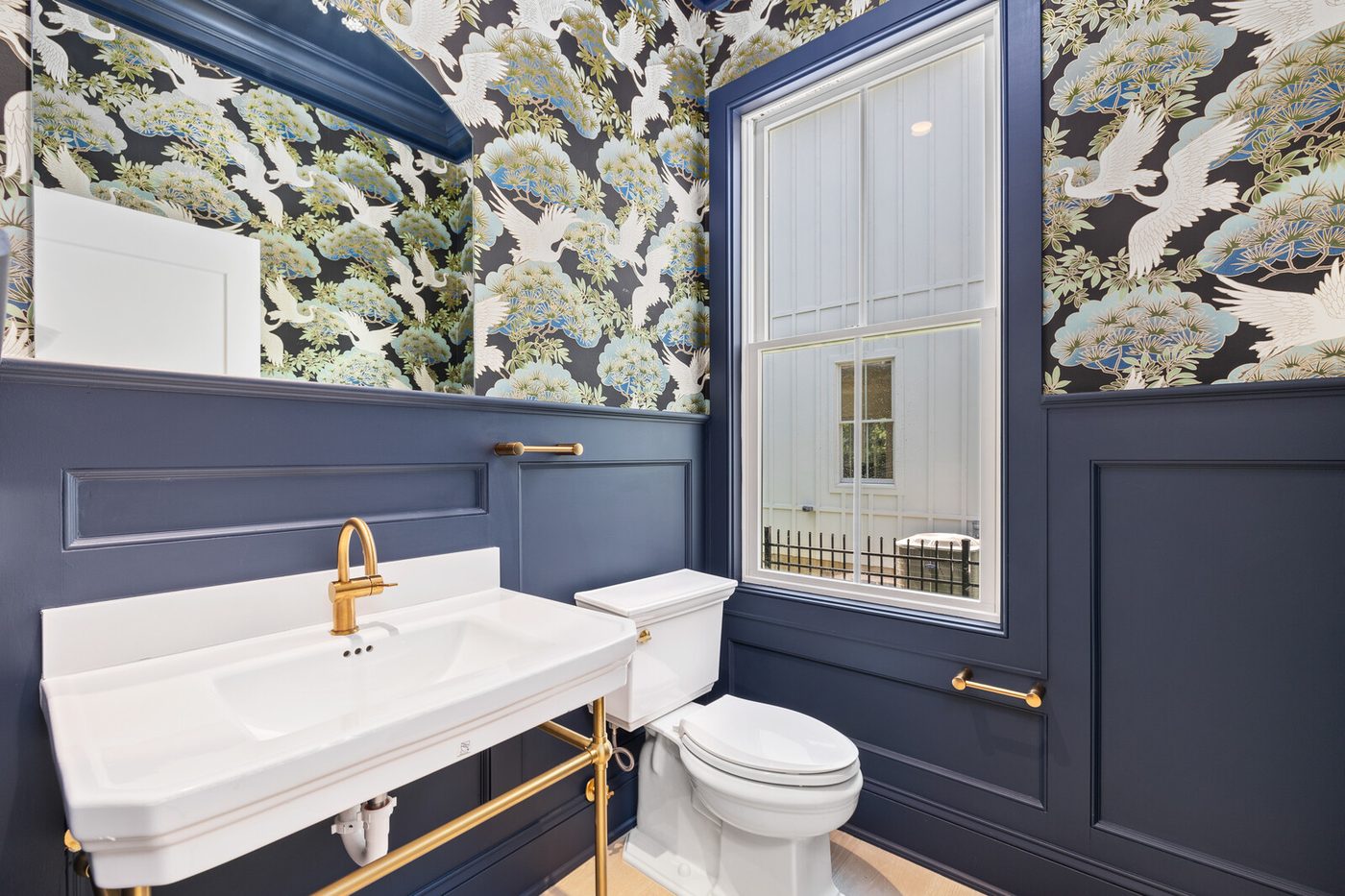 Powder room with statement lighting