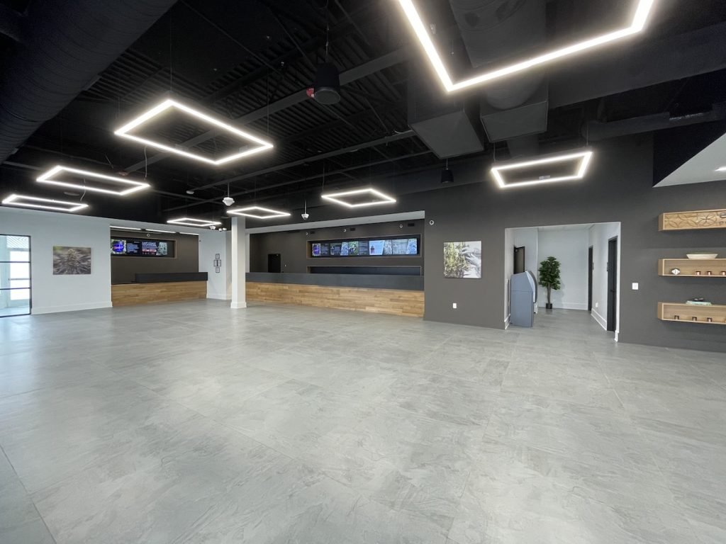 Zen Leaf dispensary showroom with architectural LED lighting and digital menu displays
